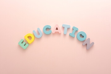 Letter block EDUCATION on a pink background