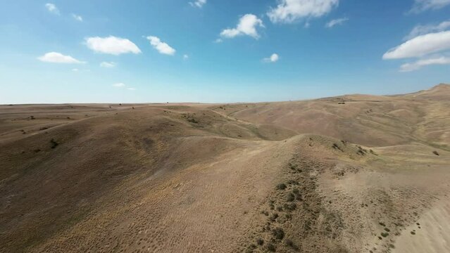 Drone flight ove the colorful hills on the steppe in Georgia near Dawid Gareji monastery