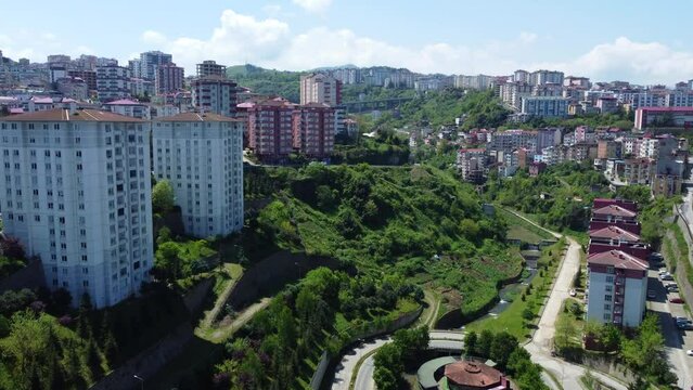 Aerial view of Trabzon, Turkey, showcasing city apartments against the backdrop on mountains.