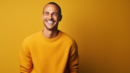 handsome young man, smiling and laughing, wearing vibrant sweater
