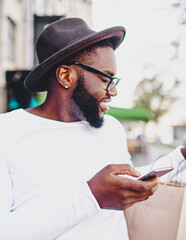  cheerful african american male happy about online buying with discount