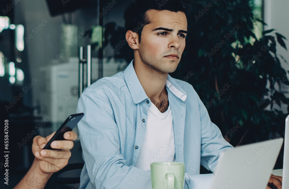Poster skilled programmer reading financial news on content website on cellular
