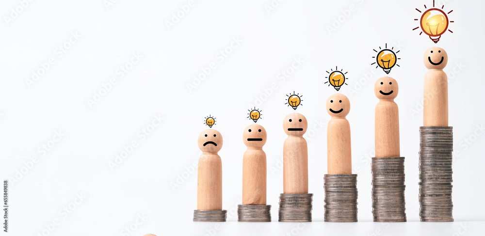 Poster wooden figure of human standing on increasing coins stack with glowing lightbulb for creative thinki