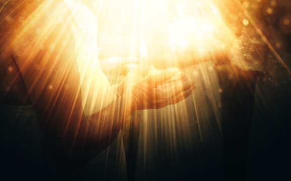 woman in a ceremonial space. Close-up shot of a woman's hand during the ceremony. Light effect.