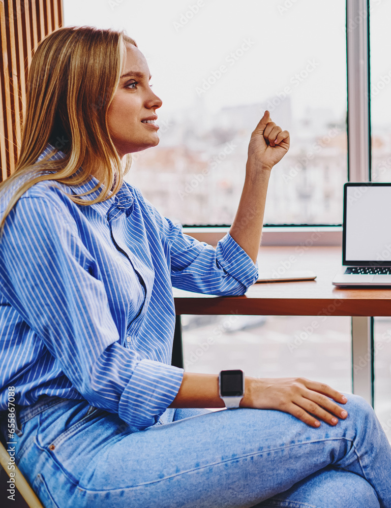 Poster colleagues communicating with each other between computer with blank screen area