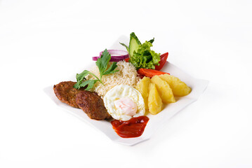 mashed potatoes with boiled rice, cutlets, egg, salad. on a white background