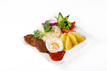 mashed potatoes with boiled rice, cutlets, egg, salad. on a white background