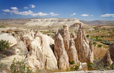 Unique geological rock formations Fairy Chimneys in Cappadocia. Popular touristic area in Turkey