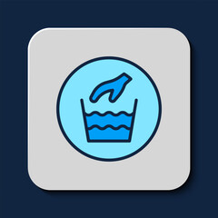 Filled outline Hand wash laundry icon isolated on blue background. Vector