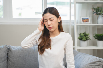 Brain stroke or low blood pressure symptom on people medical concept. Young beautiful woman has a dizziness and motion blurry during standing off sofa at home