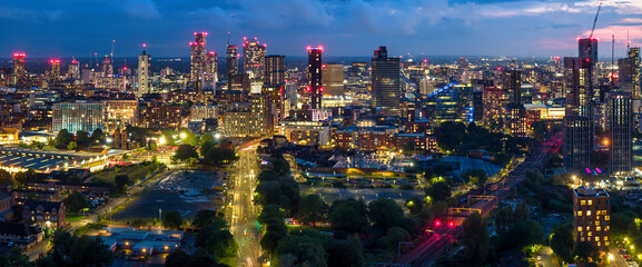 Aerial panoramic view of Manchester City skyline at night