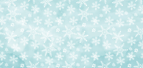 Art Christmas background with hand drawn snowflakes on blue watercolor background. Template design for text, packaging and prints.