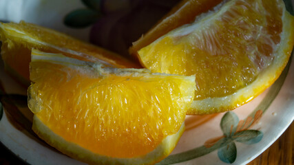 A slice of orange. Sliced orange on a plate. Close-up of an orange