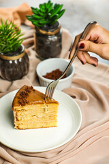 Salted Caramel Blondie cake slice include chocolate cream, sugar with fork, cup of coffee and pot served plate isolated on napkin side view of cafe food