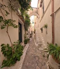 A street among the white painted houses of Sperlonga, a village in the province of Latina, Italy.