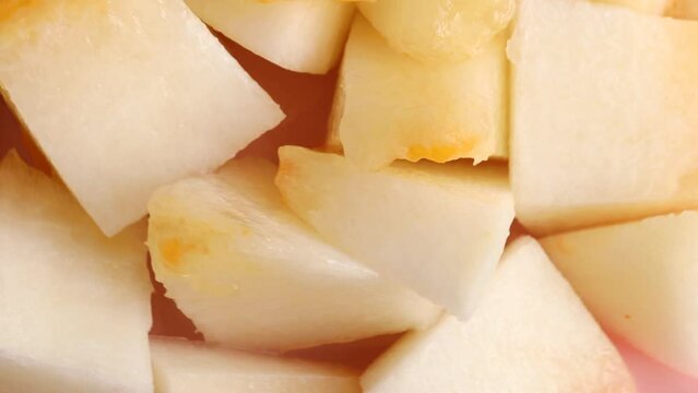 Fresh melon pieces, rotation in circle. slices of ripe juicy melon Turning. selective focus.  