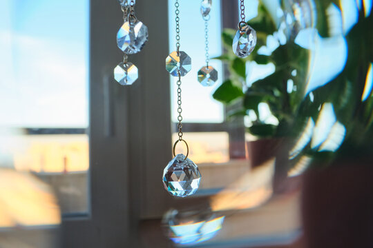 Abstract background with suncatcher crystals on home.