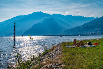 Relaxing scene in a n autumnal evening on Lake Como - obrazy, fototapety, plakaty