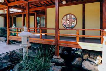 Scenic view of the courtyard garden behind the sliding grid doors (shoji) of a traditional Japanese...