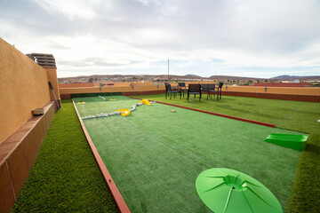 Miniature golf course on the rooftop of a villa 