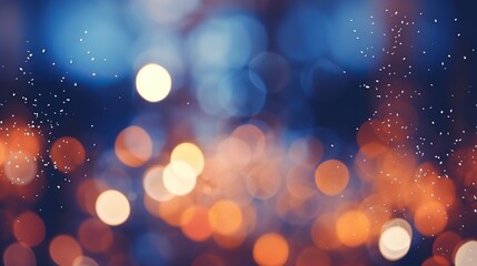 Yellow and orange lights on a blue background in defocus. Abstract bokeh backdrop. New year and...