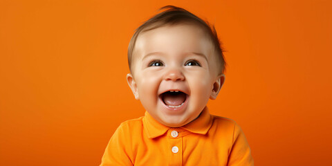 baby on an orange background, newborn,  - obrazy, fototapety, plakaty