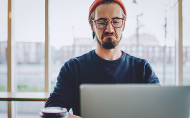  hipster guy watching online video