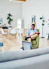 Happy african american hipster guy laughing having fun during free time at home with girlfriend