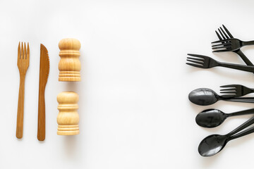 Eco friendly wooden and harmful plastic cutlery. Zero waste concept