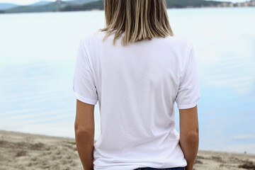Back White t shirt mockup with copy space. Woman's blank white tshirt template with lake background