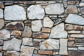 Folded natural stone wall abstract background.
