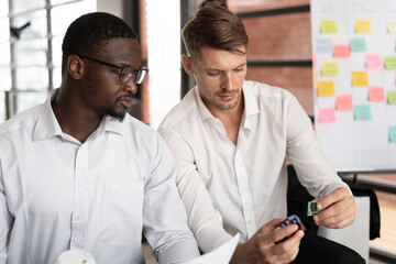 African American businessman meeting with team business in office	