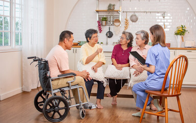 Group of happy elderly people, doctor talking together in community, consulting mental health, smiling with happiness, sitting in indoor nursing home. Retirement, Healthcare Concept.