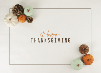 Happy Thanksgiving greeting background with flat lay of pumpkins in frame with modern minimalism...