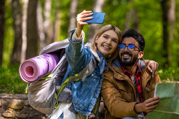 Happy travelers making selfie and looking excited