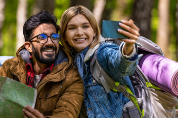 Happy travelers making selfie and looking excited