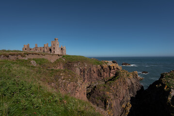 Fototapeta na wymiar Ruins of Slains Castle in scottish highlands. Great place for tourist doing north coast 500. Nice piece of scotland landscape and history. 