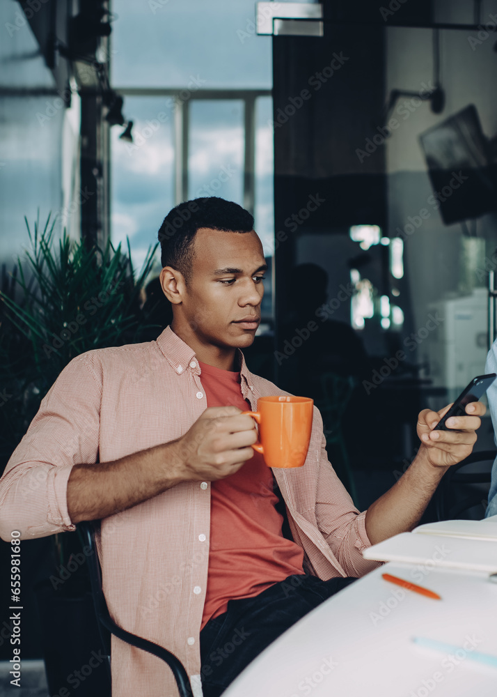 Poster skilled programmer reading financial news on content website on cellular