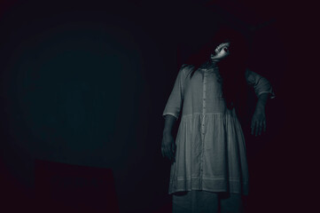 Portrait of asian woman make up ghost face with blood,Horror scene,Scary background,Halloween...