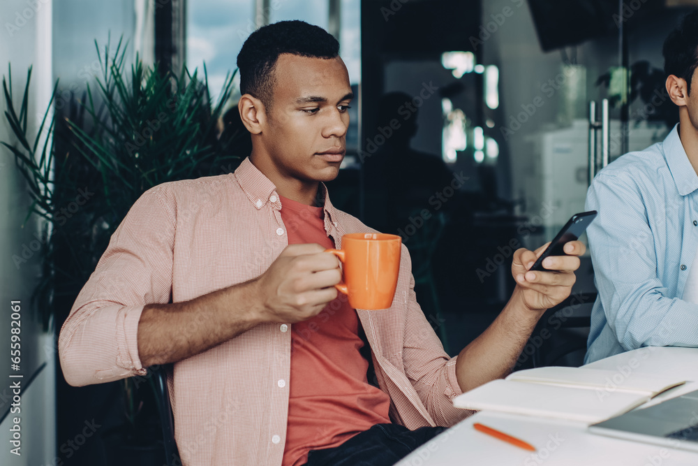 Poster skilled programmer reading financial news on content website on cellular