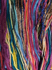 Multi colored strands of yarn background