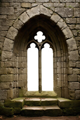 a castle or palace Gothic arch stone medieval window. Brick, stone wall. Isolated transparent background.