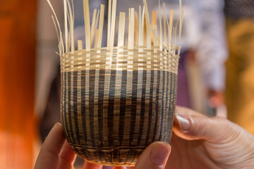 handmade cups made by weaving bamboo by local burmese people in the traditional way, Pagan,