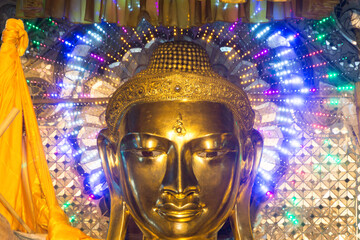 BUDDHA STATUE with modern electric halo at the SHWEDAGON  PAGODA