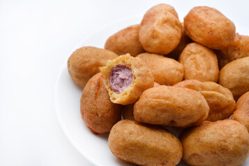 Sausages in dough on a white plate. Delicious meat appetizer in batter.