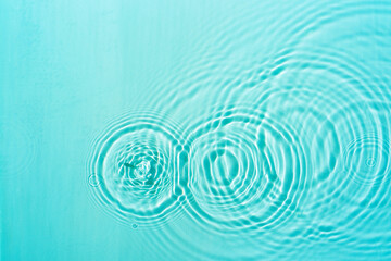 Pattern of circles on clear water from drops