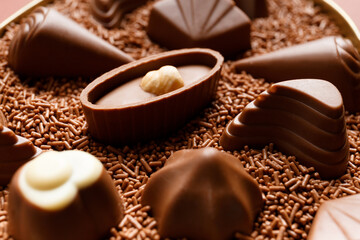 Candies in chocolate chips close-up macro photography.