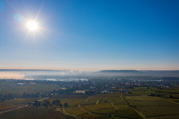 Bird's eye view of Eltville am Rhein - Germany in the morning mist with the rising sun