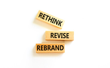 Rethink revise rebrand symbol. Concept word Rethink Revise Rebrand on beautiful block. Beautiful white table white background. Business brand motivational rethink revise rebrand concept. Copy space.