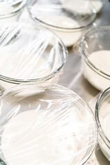 Glass mixing bowls with white royal icing